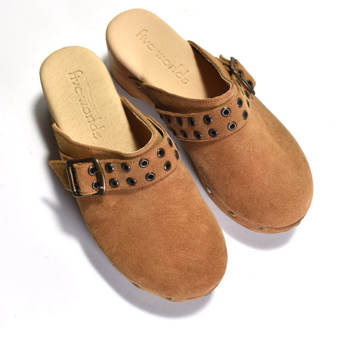 Pair of brown CLOGS with decorative straps on a white background