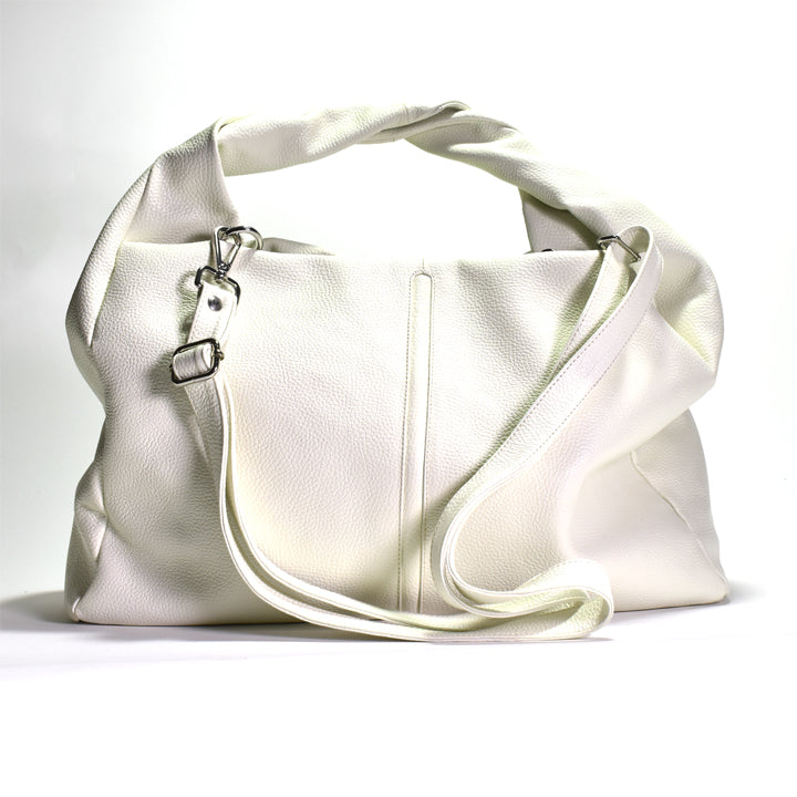 A white shoulder tote bag made of Italian pebbled leather with a cotton lining, featuring a silver colored hardware closure