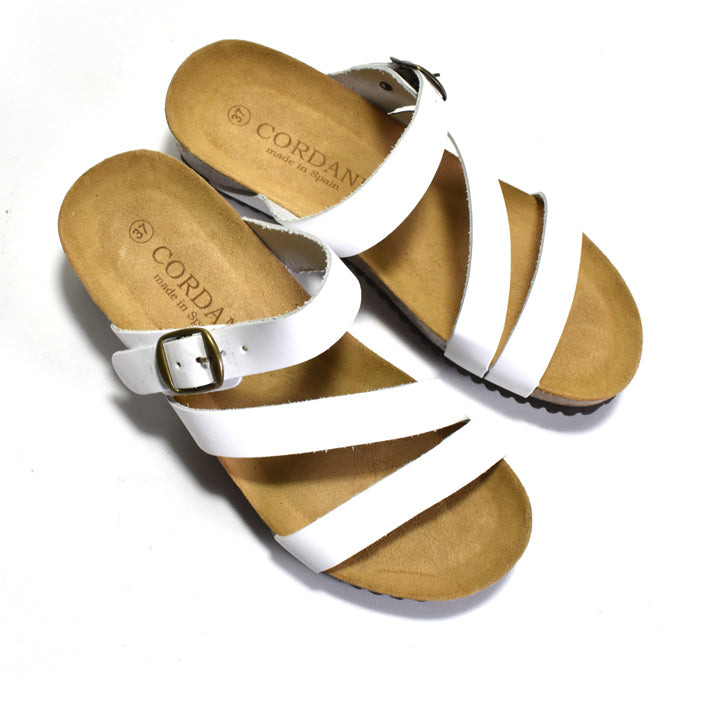Pair of sandals with white straps on a white background