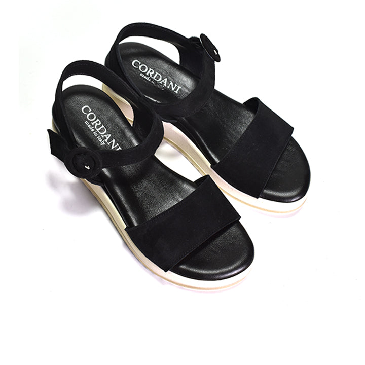 Pair of Black and white sandal with wedge heel