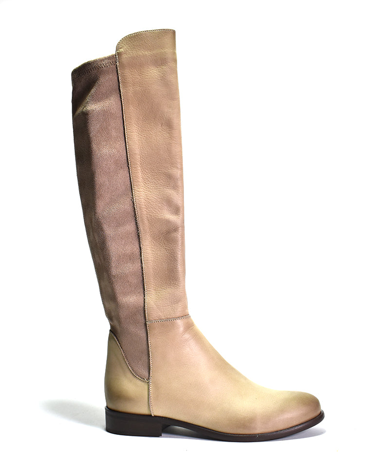A beige suede knee-high boot with a stretch panel and a stacked heel.