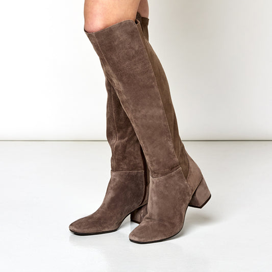 Brown suede knee-high boots on a white background
