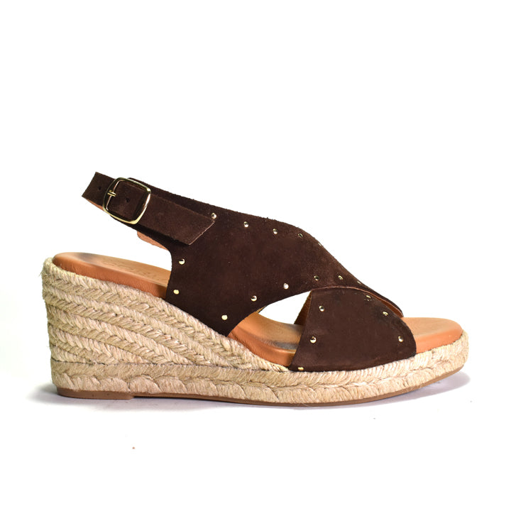 Brown wedge sandal with espadrille sole on a white background