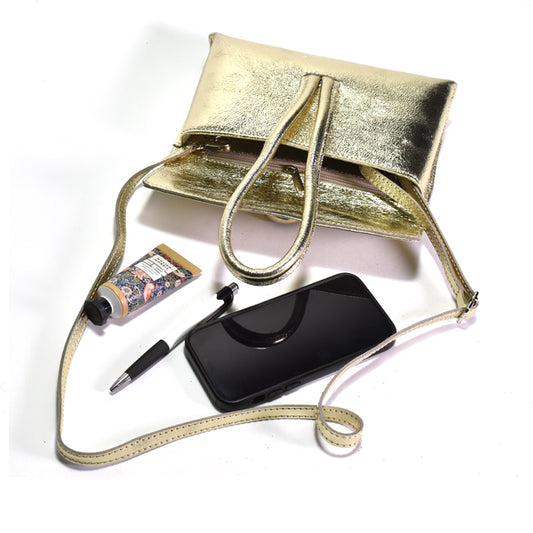 Laminated leather clutch with strap and phone, pen and lotion