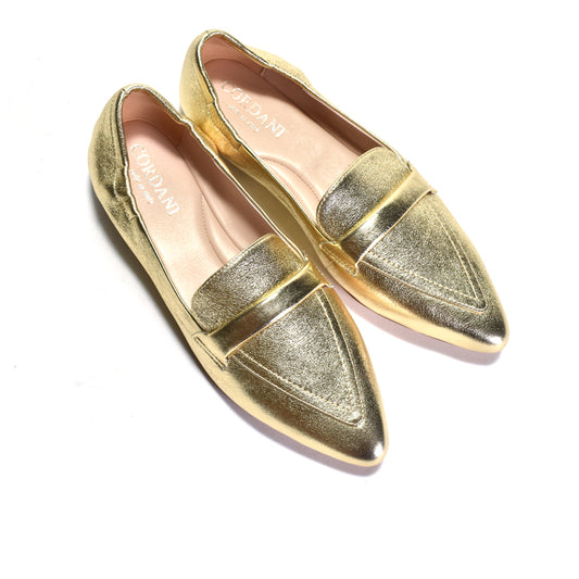 Pair of gold loafers on a white background