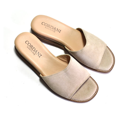 Pair of beige sandals with 'Cordani' branding on a white background