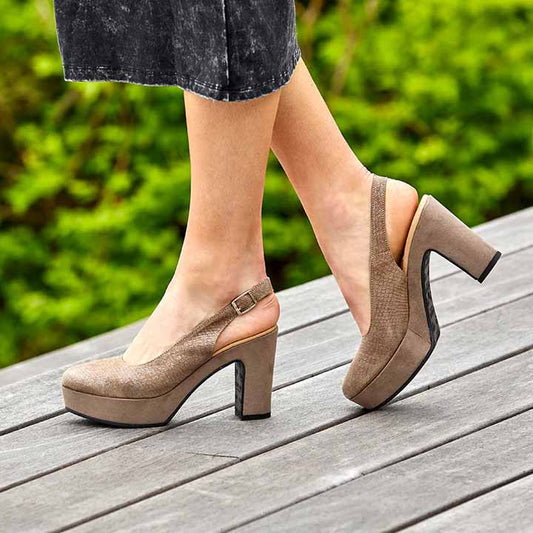 A brown suede closed-toe slingback platform heel with a buckle strap and wrapped heel, set against a white background.