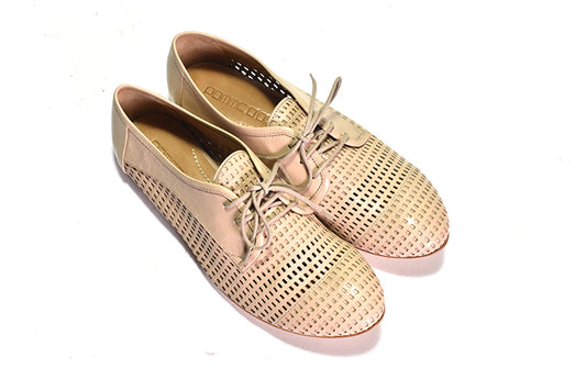 Pair of tan shoes with laces