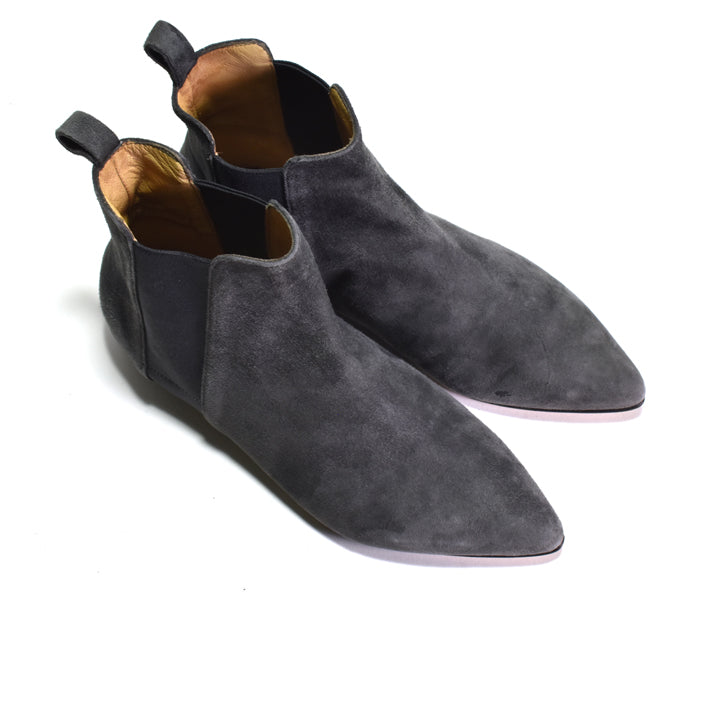 A pair of dark gray suede Chelsea boots with black elastic side panels, shown on a clean white background.