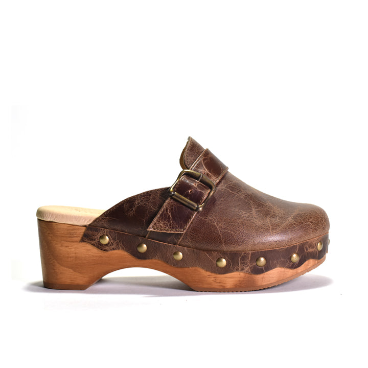 Brown leather clog shoe with wooden sole on a white background
