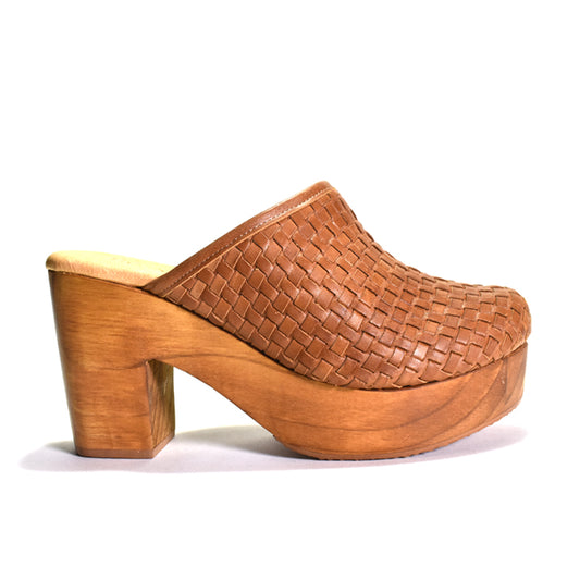 A single women's clog shoe with a woven tan leather upper and a chunky wooden platform block heel, shown from a side profile on a white background.