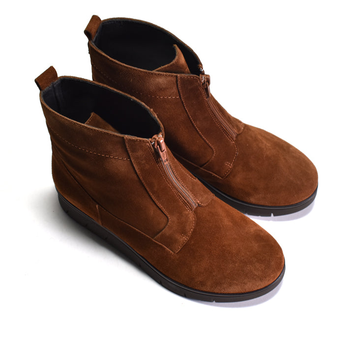 Pair of brown suede boots on a white background