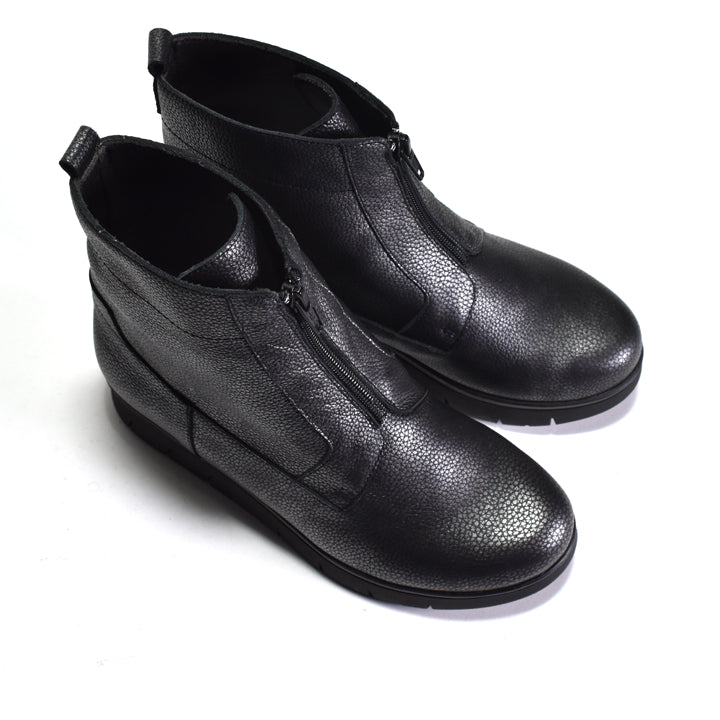 Pair of black leather ankle boots on a white background