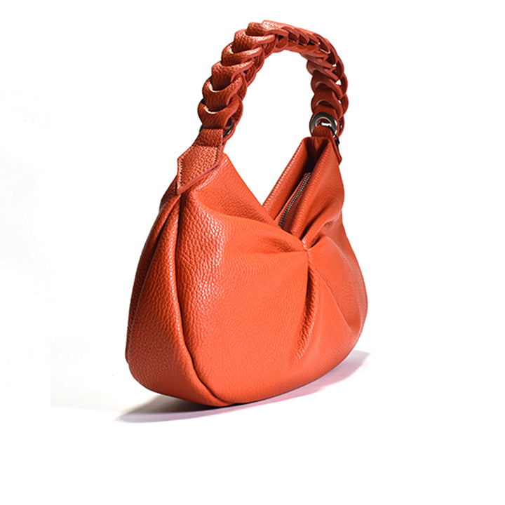 An orange leather shoulder hobo bag with a leather chain link handle.