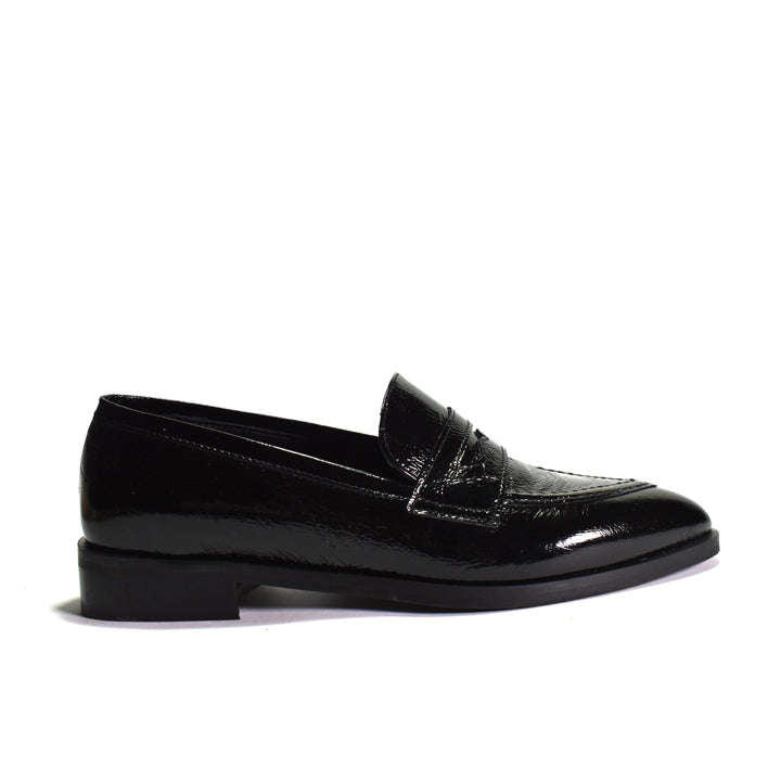 black shiny loafer on a white background