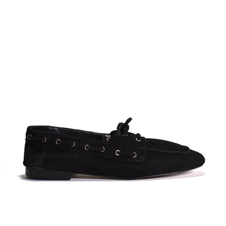 Black loafers on a white background