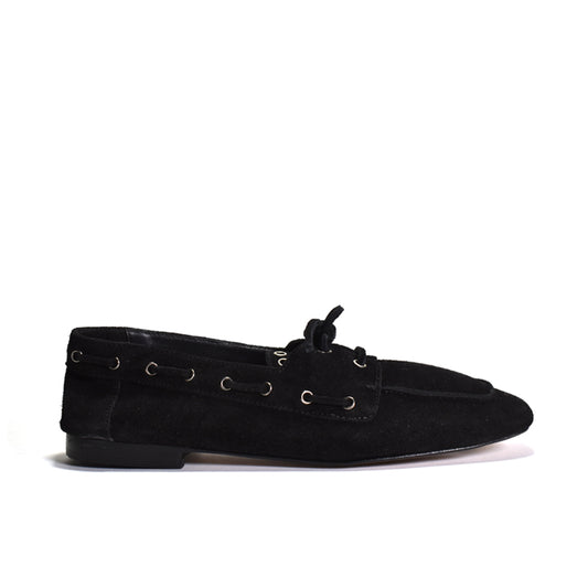 Black loafers on a white background