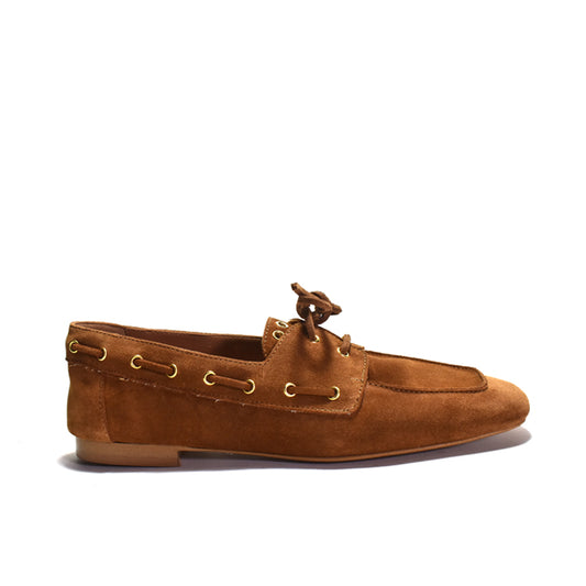 Brown suede boat shoe with gold accents on a white background