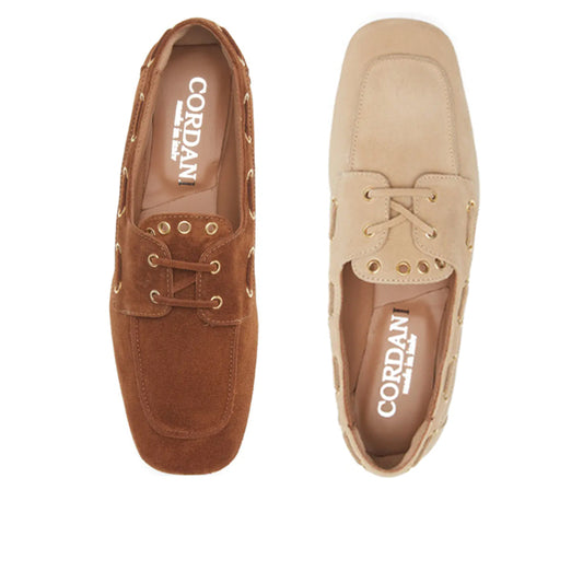one brown and one beige boat shoe on a white background