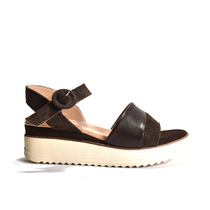 Brown sandal with a platform sole on a white background