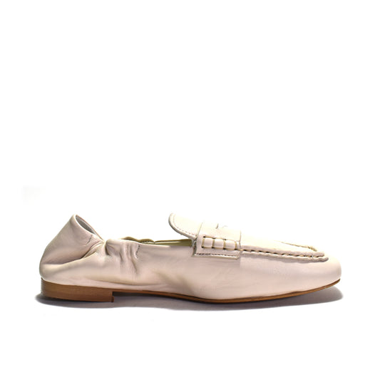 Beige loafer shoe on a white background