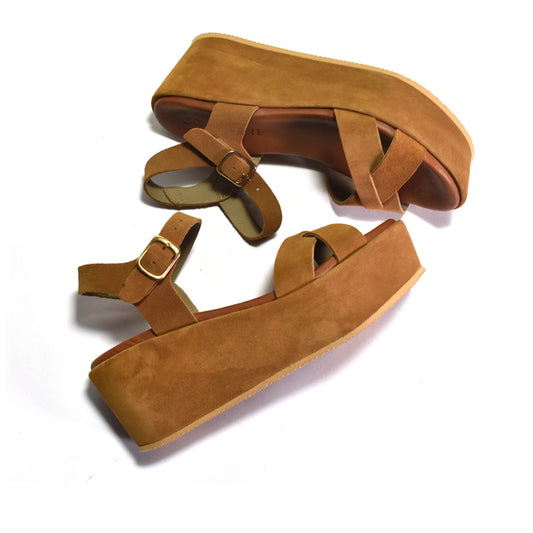 Brown suede sandals with multiple straps on a white background