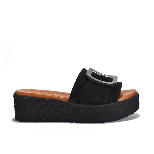 Black sandal with a thick sole on a white background