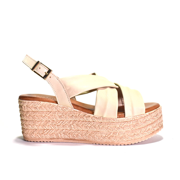 Beige wedge sandal with espadrille sole on a white background