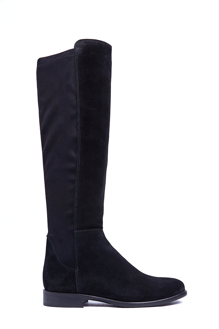 A black suede knee-high boot with a stretch panel and a stacked heel.