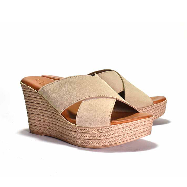 Beige wedge sandals with espadrille sole on a white background