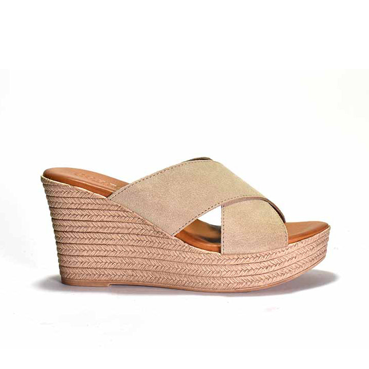 Beige wedge sandal with espadrille sole on a white background