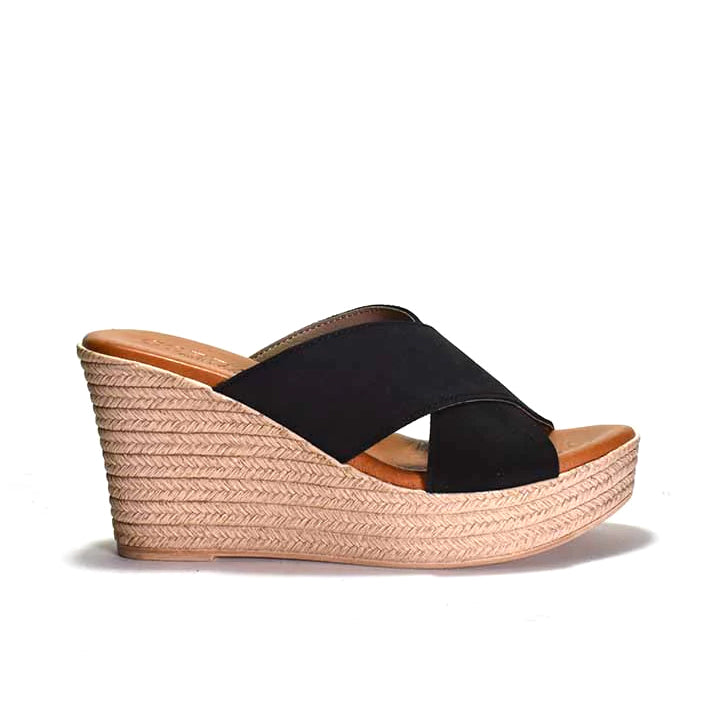 Black wedge sandal with espadrille sole on a white background