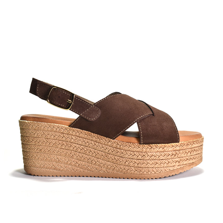 A single brown wedge sandal with a braided jute-like platform sole and a back strap, shown from a side profile on a white background.