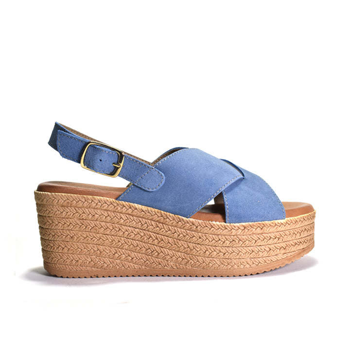 A single blue suede platform sandal with a braided jute-like wedge heel and a matching blue ankle strap with a gold buckle, shown from a side profile on a white background.