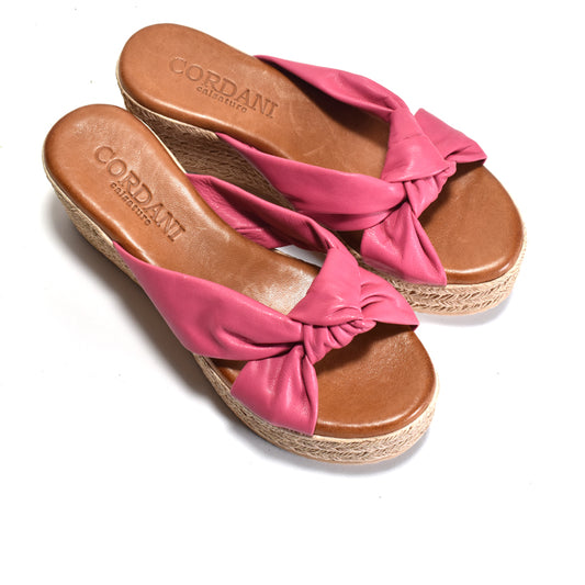 A pair of Cordant Paris espadrille wedge sandals in pink leather with brown footbeds and natural jute-look wedge heels, shown on a white background.