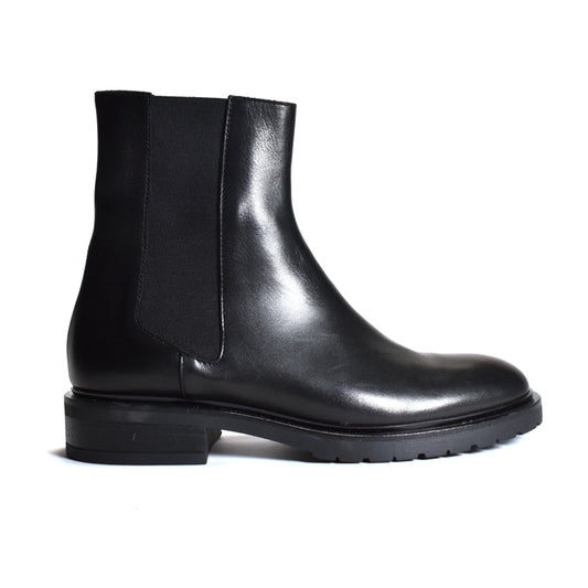 A black leather Chelsea boot with a black elastic side panel, shown in a side profile view against a plain white background.