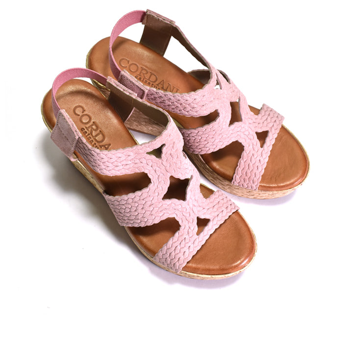 Pink sandals on a white background