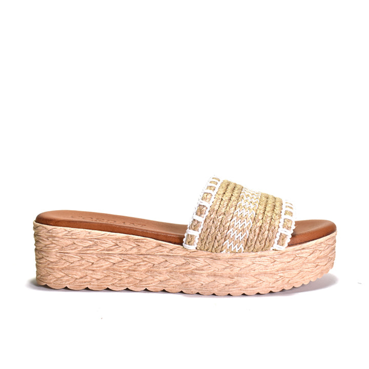 Woven sandal with a platform sole on a white background