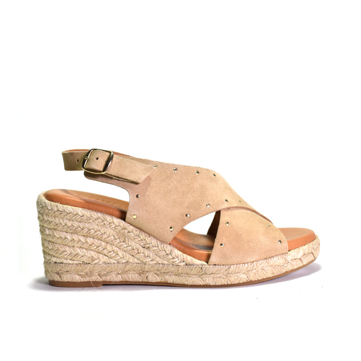 Beige wedge sandal with espadrille sole on a white background