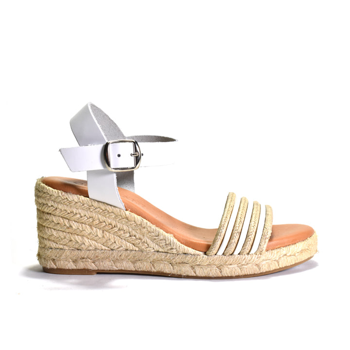 white wedge sandal with espadrille sole on a white background