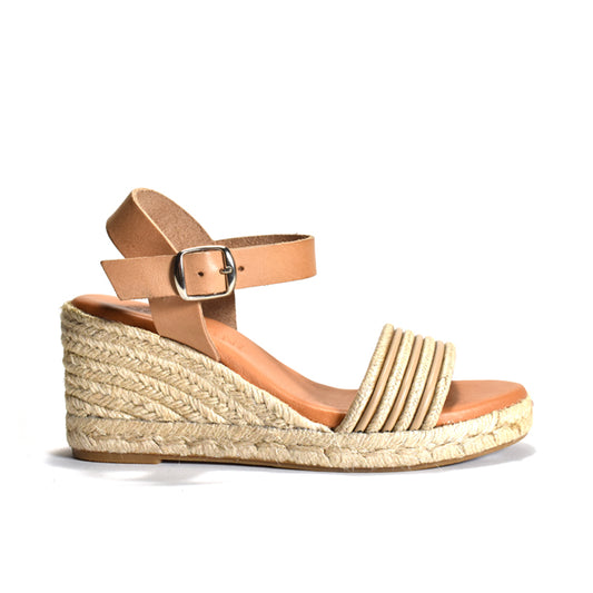 A single women's wedge sandal shown in profile against a plain white background. The sandal features a woven jute wedge and platform, a tan leather ankle strap with a silver buckle, and a beige braided toe strap.