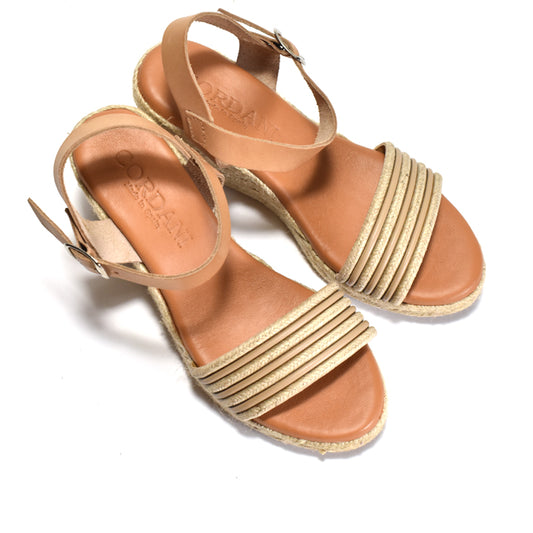 A pair of women's espadrille-style sandals with tan leather straps and footbeds, featuring tan leather horizontal straps across the toes and adjustable ankle straps, shown on a white background.