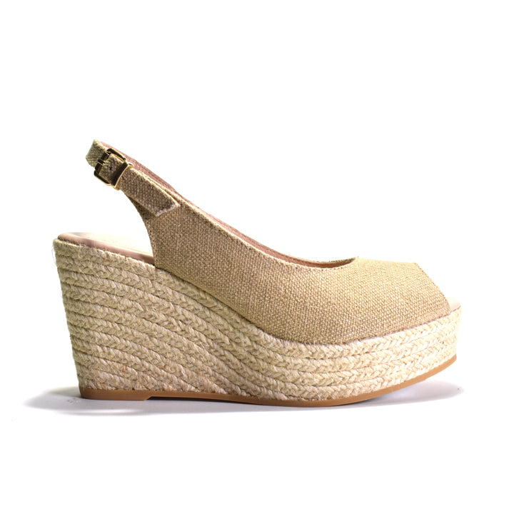 Beige wedge sandal with espadrille sole on a white background