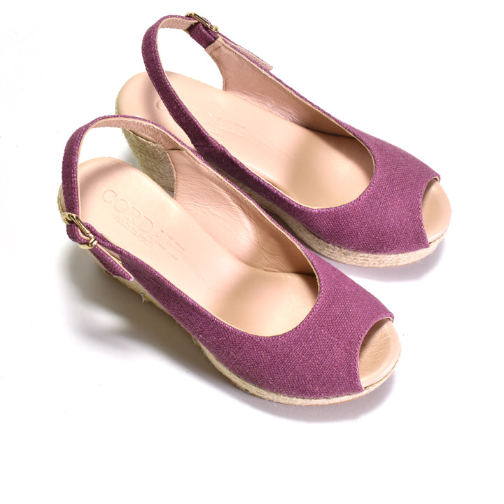 Purple open-toe shoes with a slingback design on a white background
