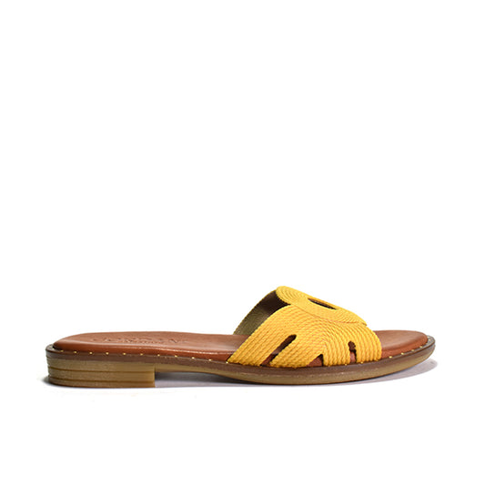 yellow flat sandals with suede upper and inlay stitch detail on a flat bottom, featuring padded footbed and leather lining.