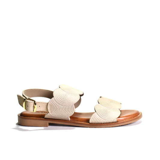 Beige sandal with woven design on a white background