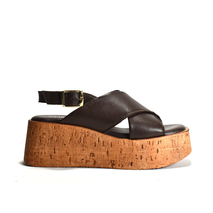 Brown sling-back sandal on a cork platform on a white background