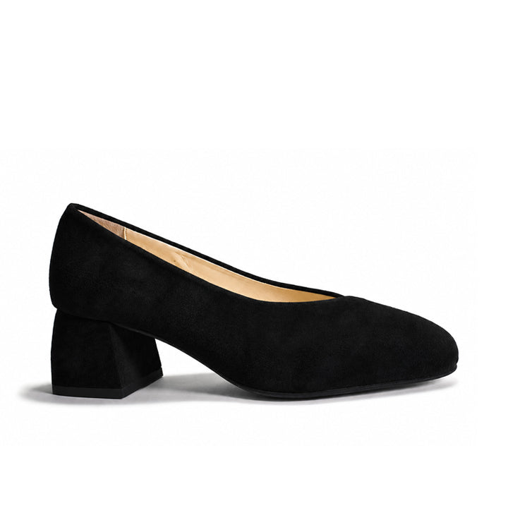 A single black suede pump shoe with a chunky block heel and rounded toe, shown in profile against a clean white background.