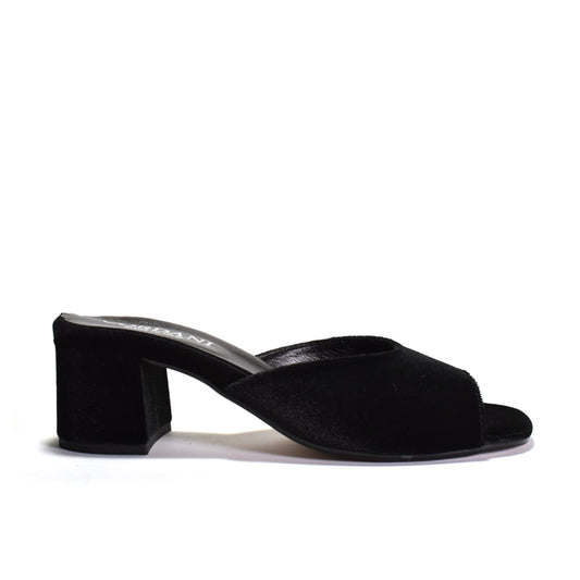 A black velvet mule sanda with a block heel on a white background.