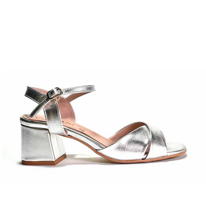 A silver criss-cross quarter strap sandal with a wrapped block heel